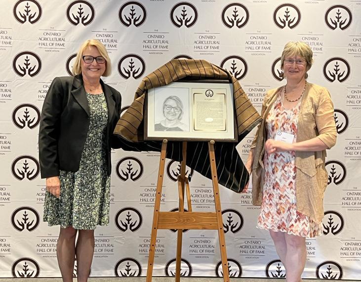 photo of Dr. Tina Widowski receiving OAC Hall of Fame award